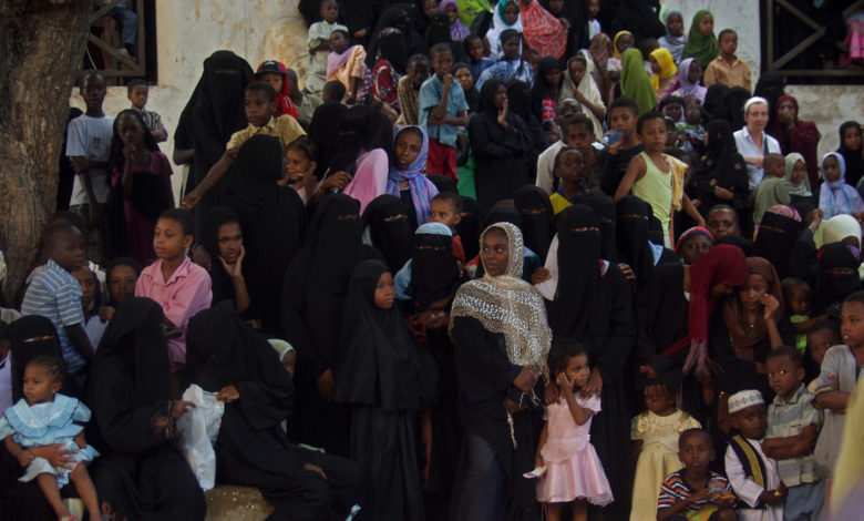 large group of women and children watching the stick fight during Islamic New Year in Lamu County. Photo: Rogiro/flickr